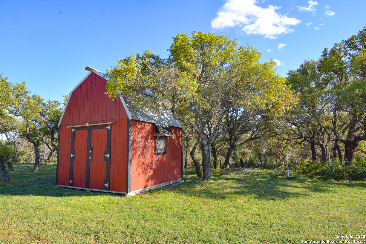 482 Wingert Road Junction, TX 76849 - Photo 23 of 61 a view of backyard of house with green space