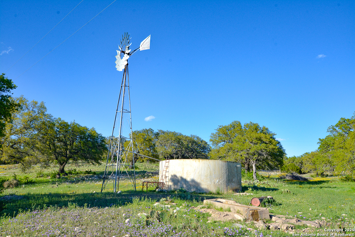482 Wingert Road Junction, TX 76849 - Photo 29 of 61 a view of a garden with plants and large trees