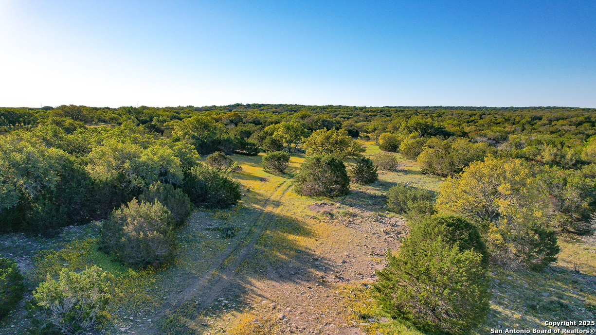482 Wingert Road Junction, TX 76849 - Photo 31 of 61 a view of a lake with mountains in the background