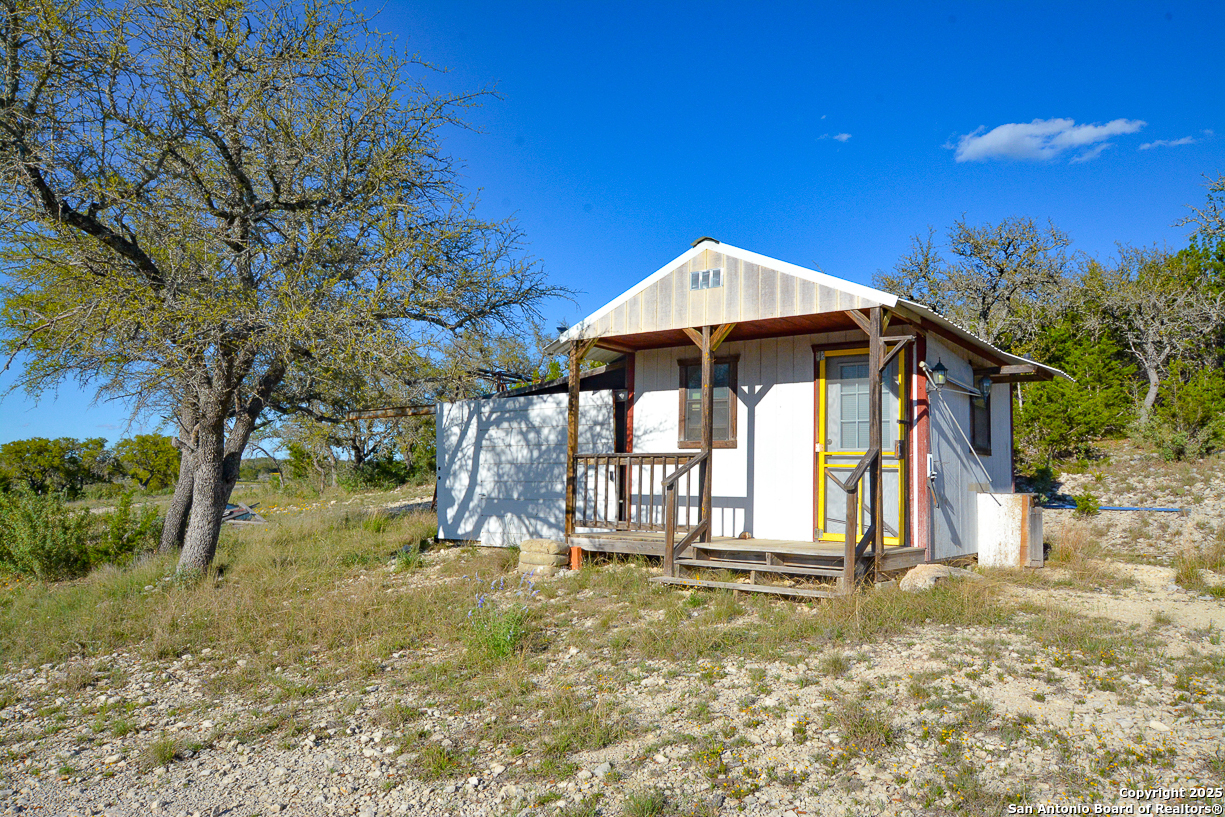 482 Wingert Road Junction, TX 76849 - Photo 36 of 61 a front view of a house with a yard