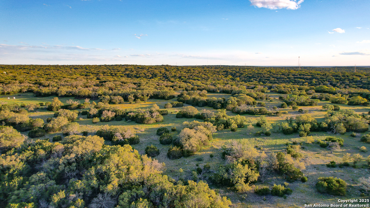 482 Wingert Road Junction, TX 76849 - Photo 56 of 61 an aerial view of residential houses with outdoor space