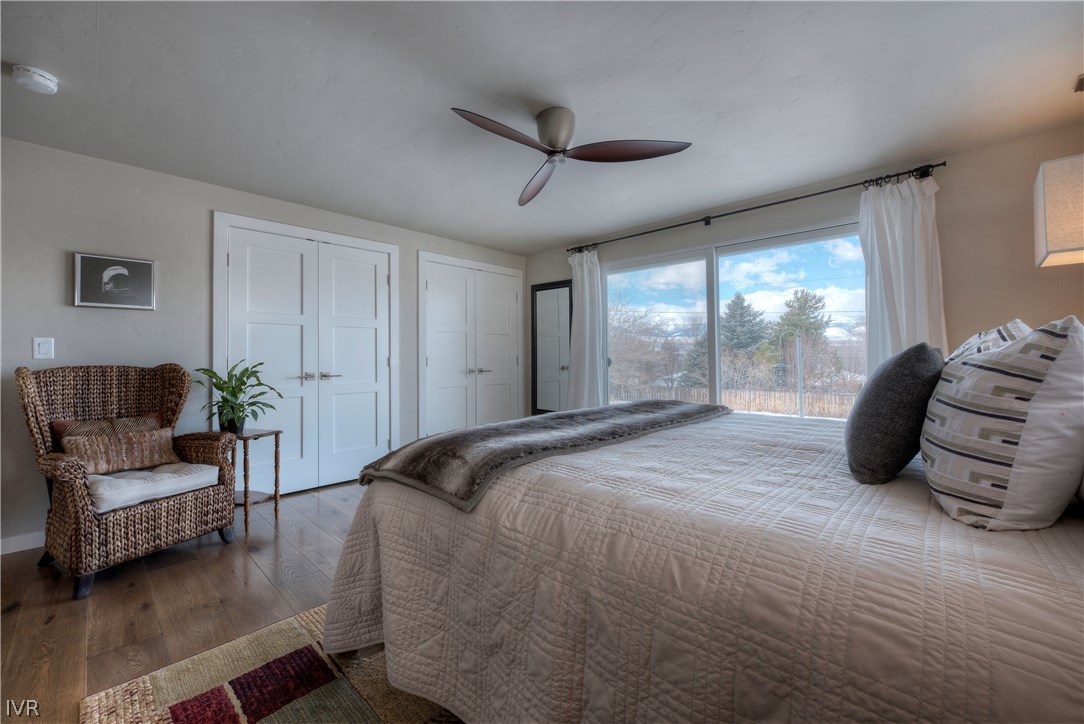 14695 Rim Rock Drive Reno, NV 89521 - Photo 18 of 30 a spacious bedroom with a bed and a couch
