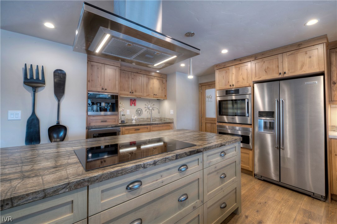 14695 Rim Rock Drive Reno, NV 89521 - Photo 10 of 30 a kitchen with stainless steel appliances granite countertop a refrigerator and a sink