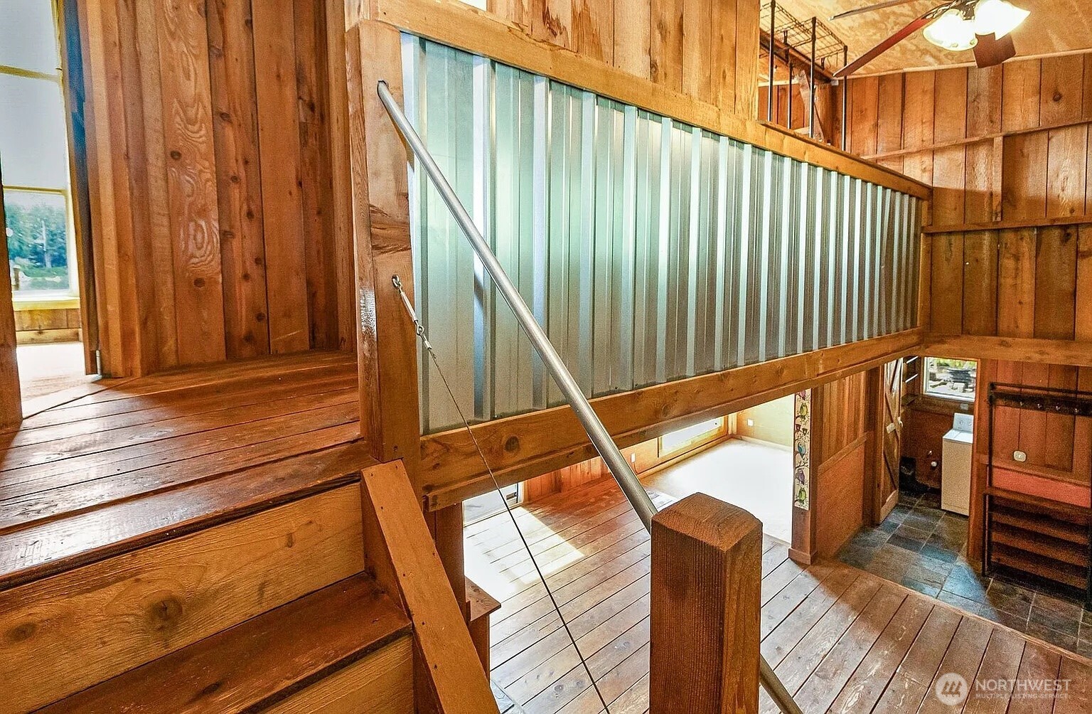 1103 Southwest Roesiger Road Snohomish, WA 98290 - Photo 17 of 32 a view of balcony with wooden floor and stairs