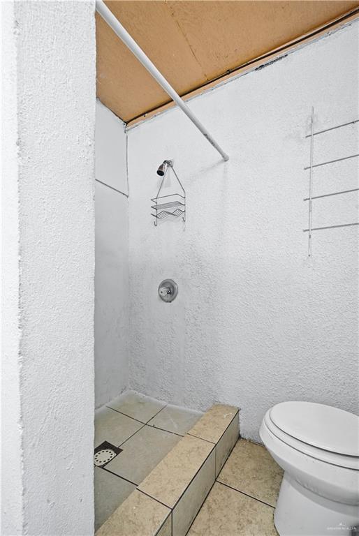 8516 Hendrix Avenue, Unit 6 Edinburg, TX 78542 - Photo 6 of 6 a bathroom with a toilet and shower