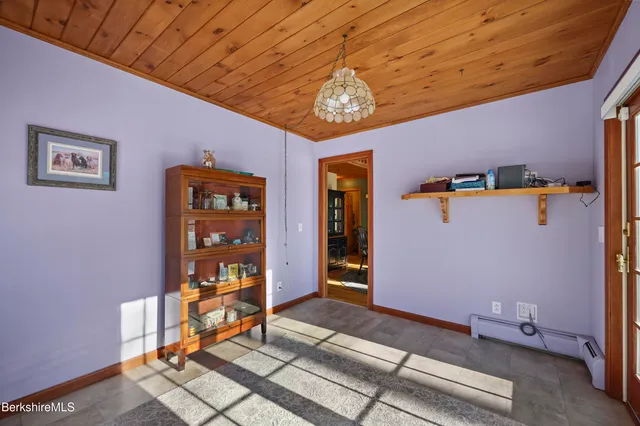 a bathroom with a sink toilet and a mirror