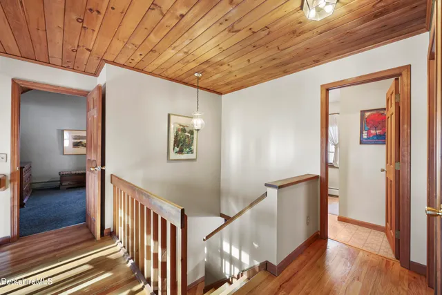 a bedroom with a bed and a tv on table