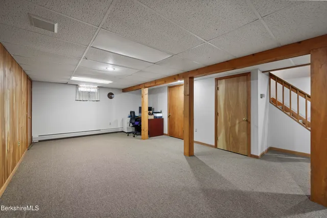 a view of a street with houses on both side of street