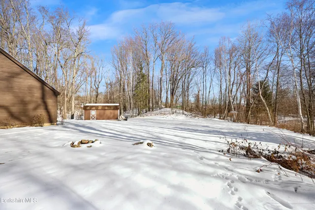 a view of city with snow on the road