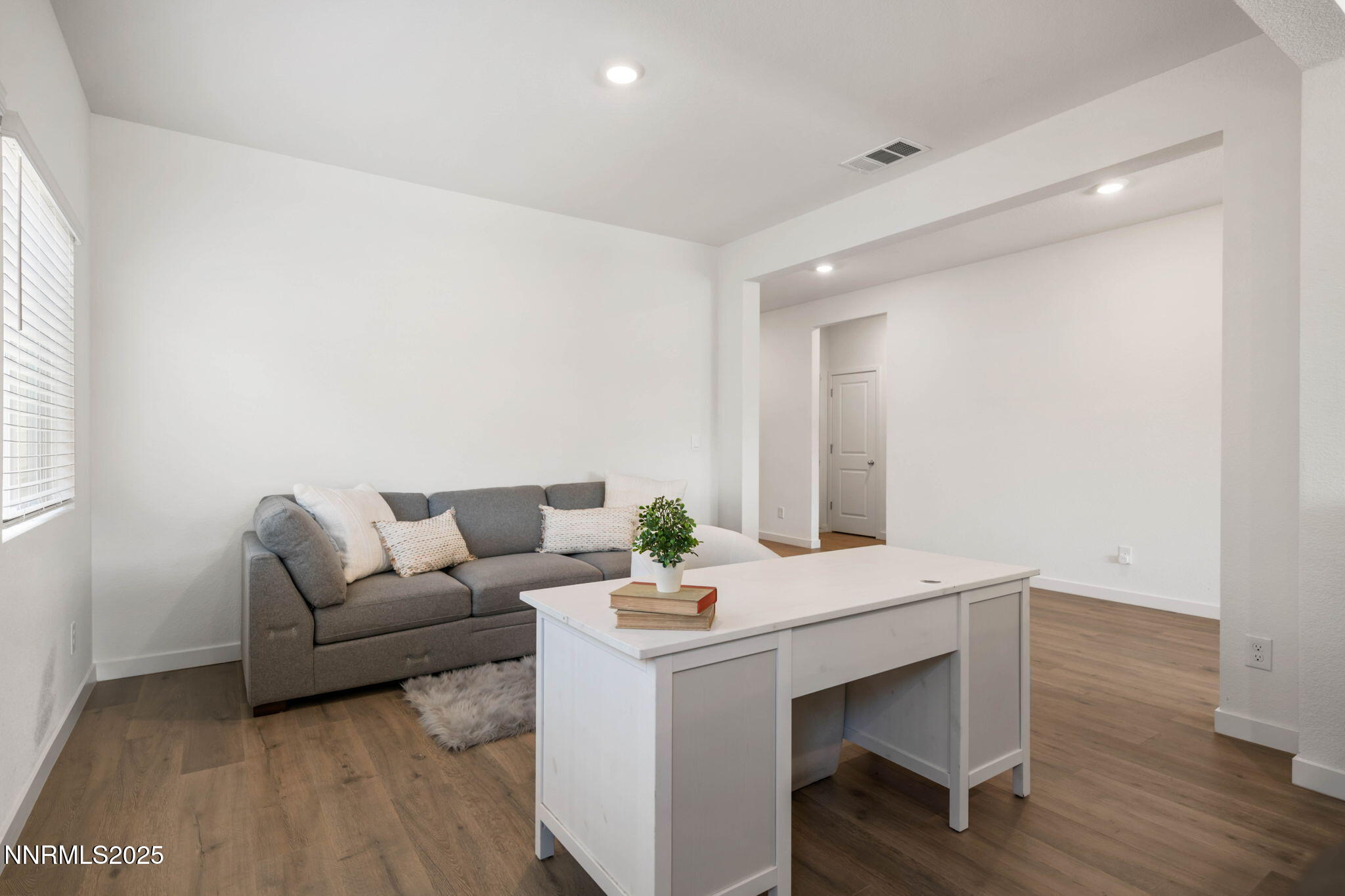 707 Butte Crk Road Dayton, NV 89403 - Photo 23 of 50 a living room with furniture and white wooden floor