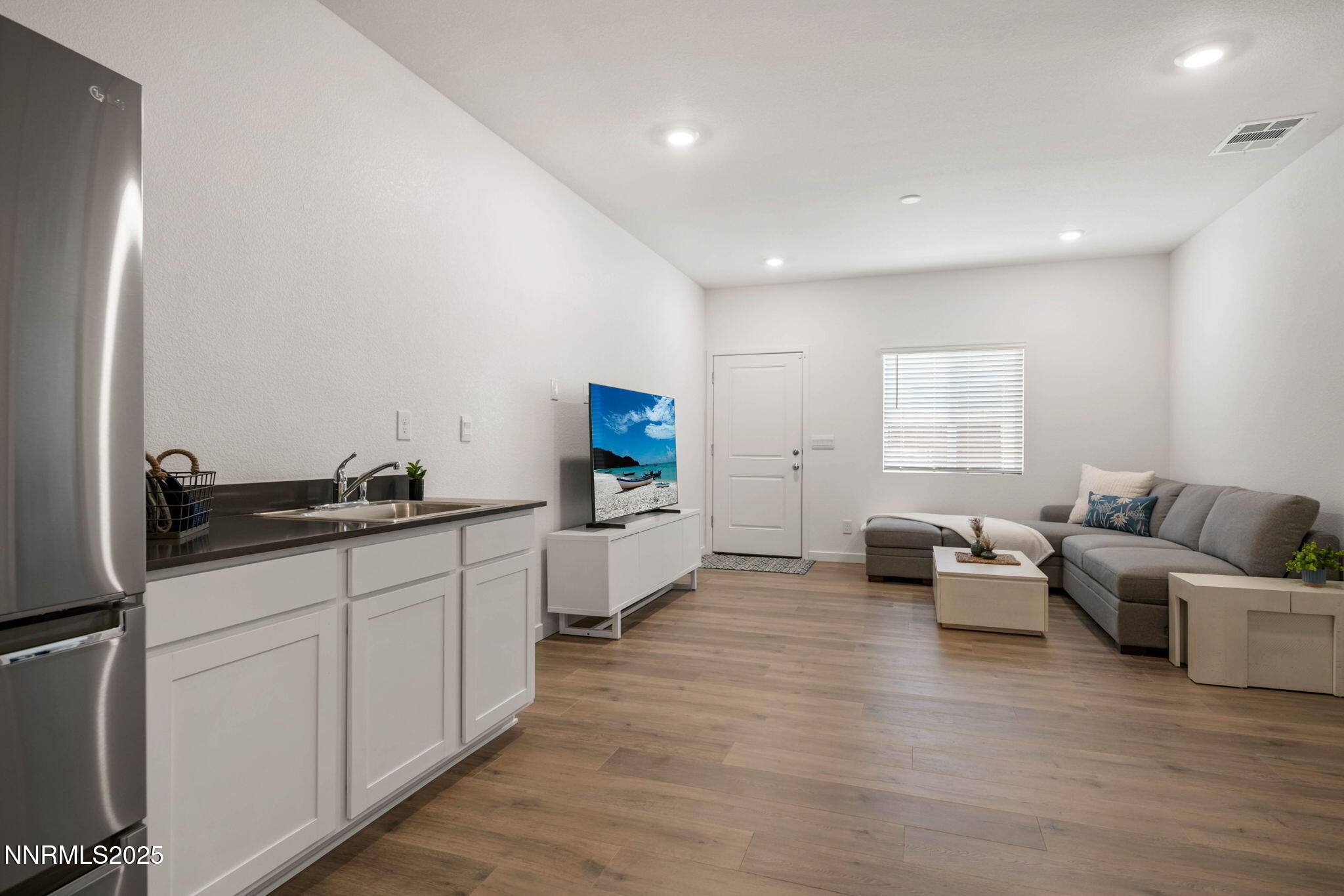 707 Butte Crk Road Dayton, NV 89403 - Photo 37 of 50 a large white room with stainless steel appliances kitchen island granite countertop a sink and cabinets