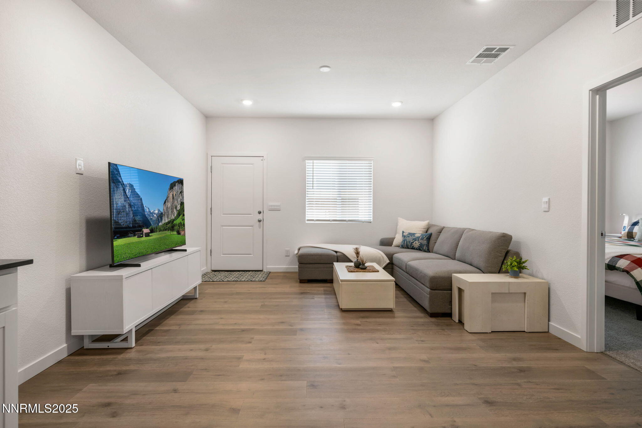 707 Butte Crk Road Dayton, NV 89403 - Photo 38 of 50 a living room with furniture and a flat screen tv