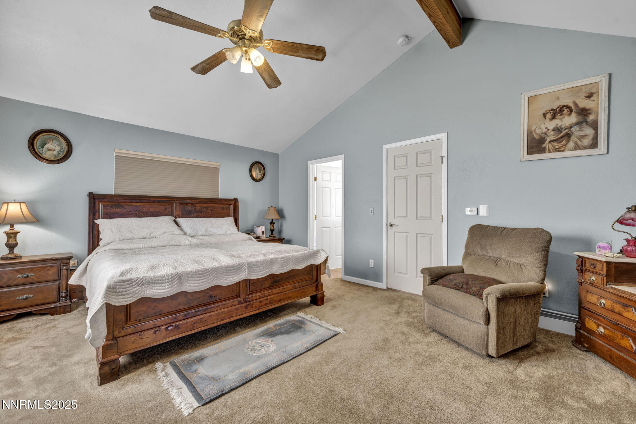 15034 North Red Rock Road Reno, NV 89508 - Photo 22 of 40 a bedroom with a bed and a chandelier