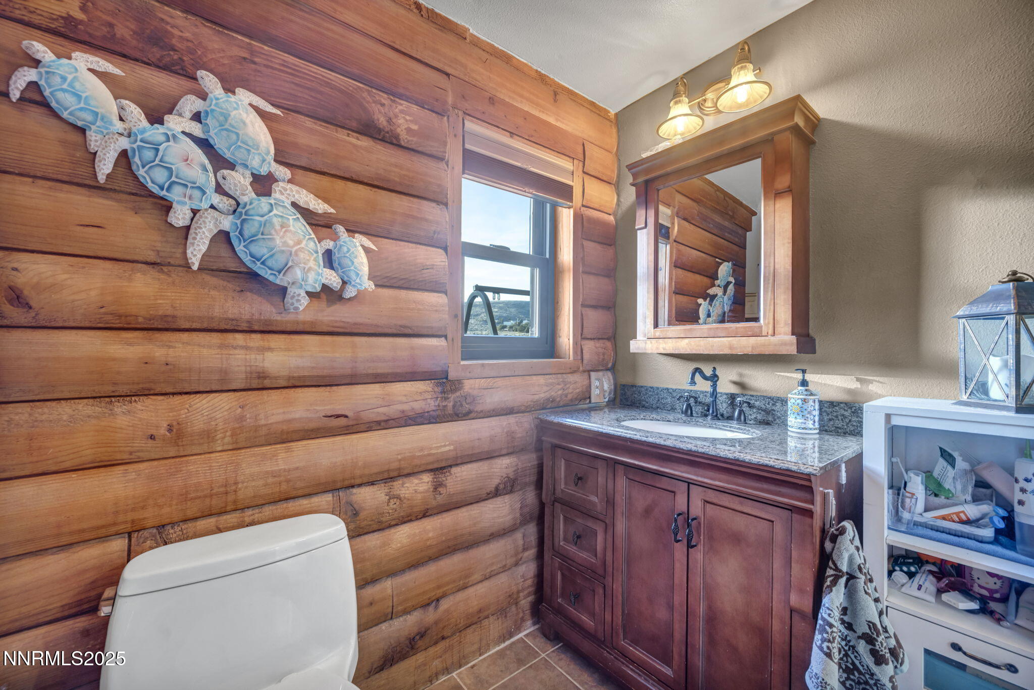 15034 North Red Rock Road Reno, NV 89508 - Photo 27 of 40 a bathroom with a toilet sink and mirror