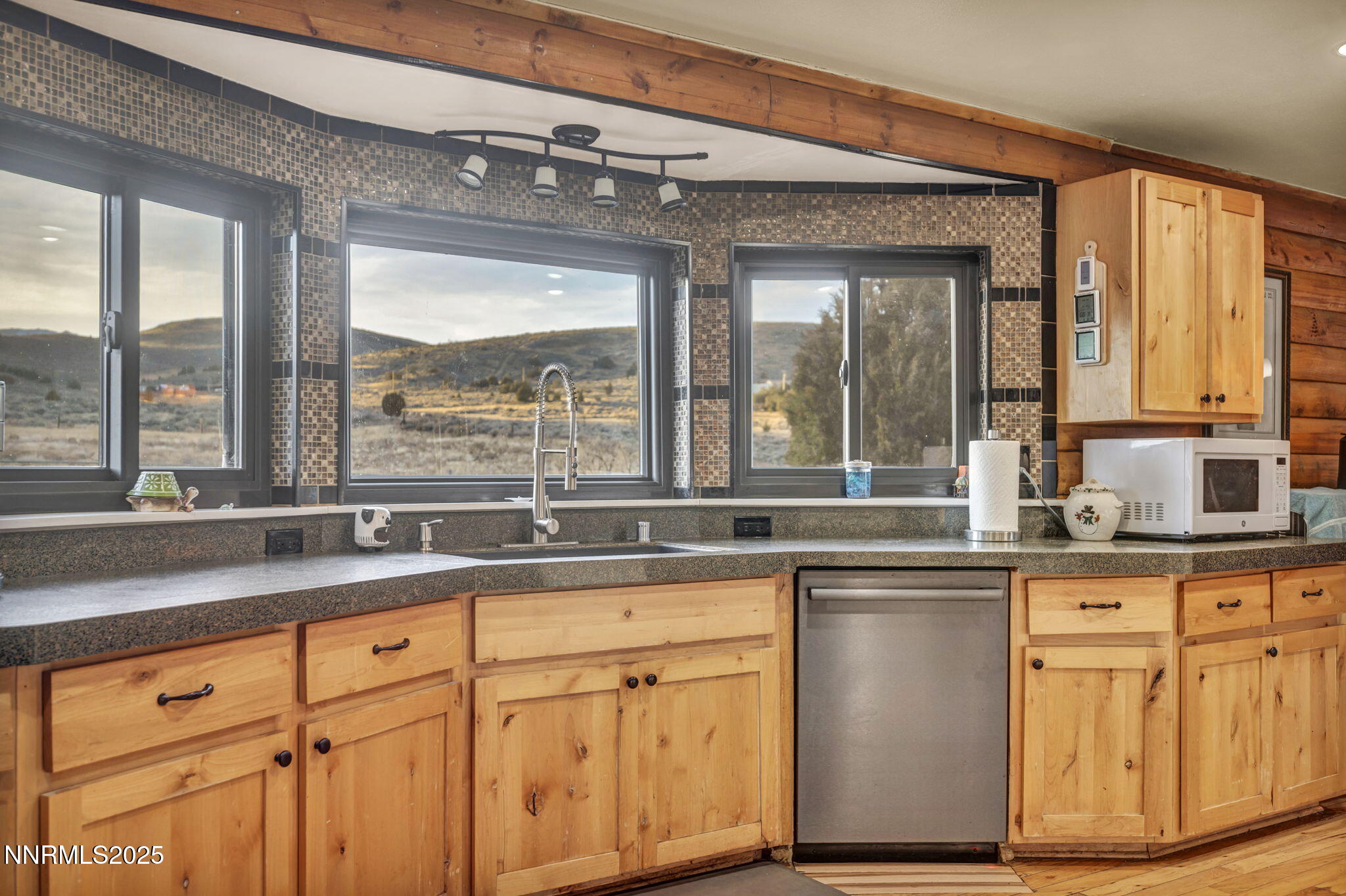 15034 North Red Rock Road Reno, NV 89508 - Photo 8 of 40 a kitchen with granite countertop a stove and a sink