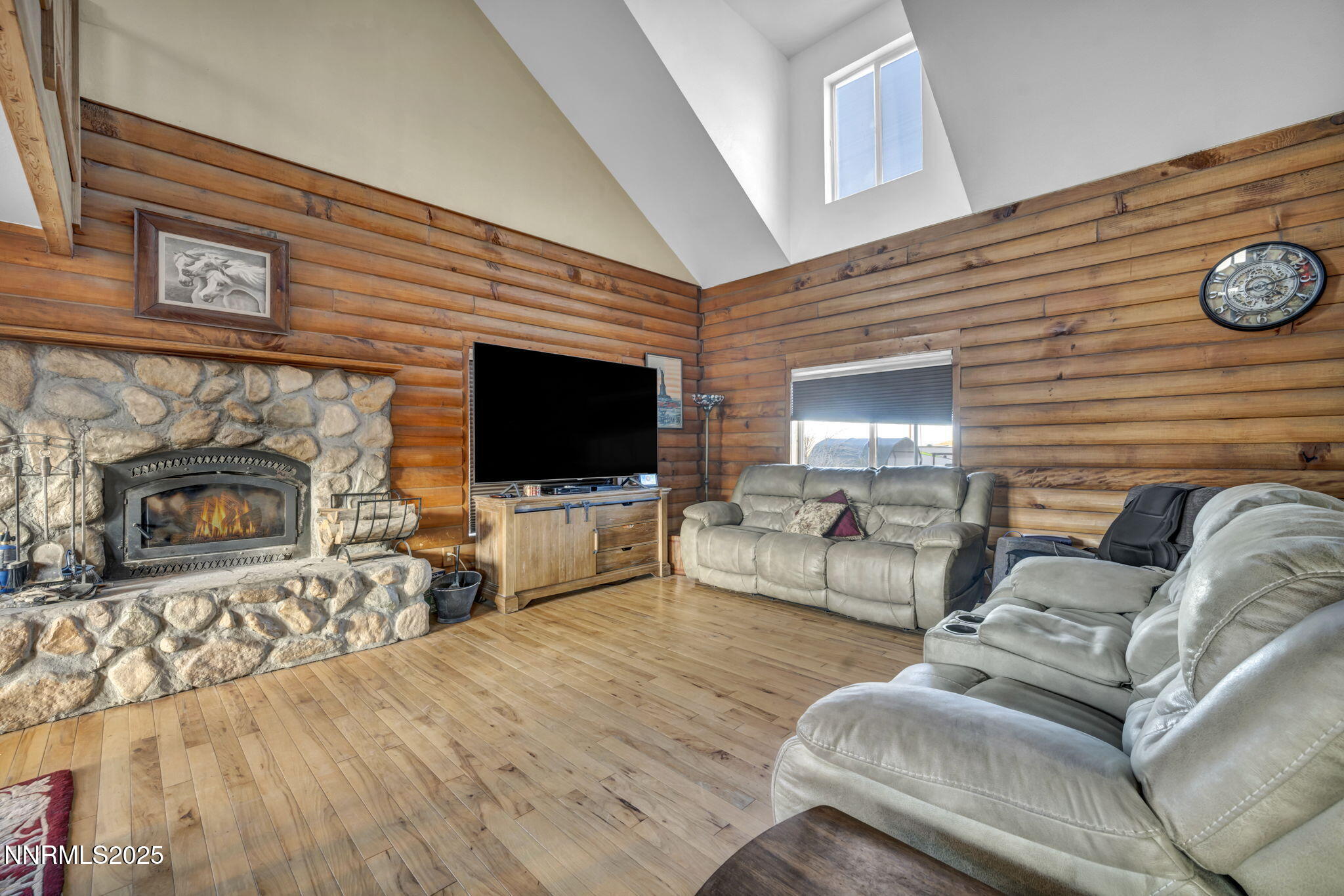 15034 North Red Rock Road Reno, NV 89508 - Photo 10 of 40 a living room with furniture a flat screen tv and a fireplace