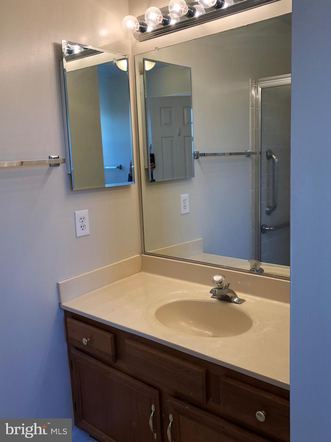 6412 View Point Court Frederick, MD 21703 - Photo 22 of 38 a bathroom with a sink and a mirror