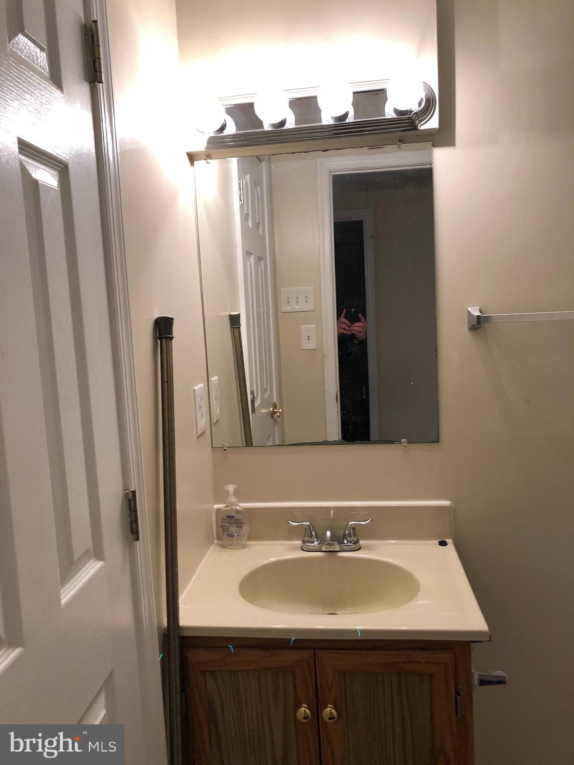 6412 View Point Court Frederick, MD 21703 - Photo 27 of 38 a bathroom with a sink and a mirror