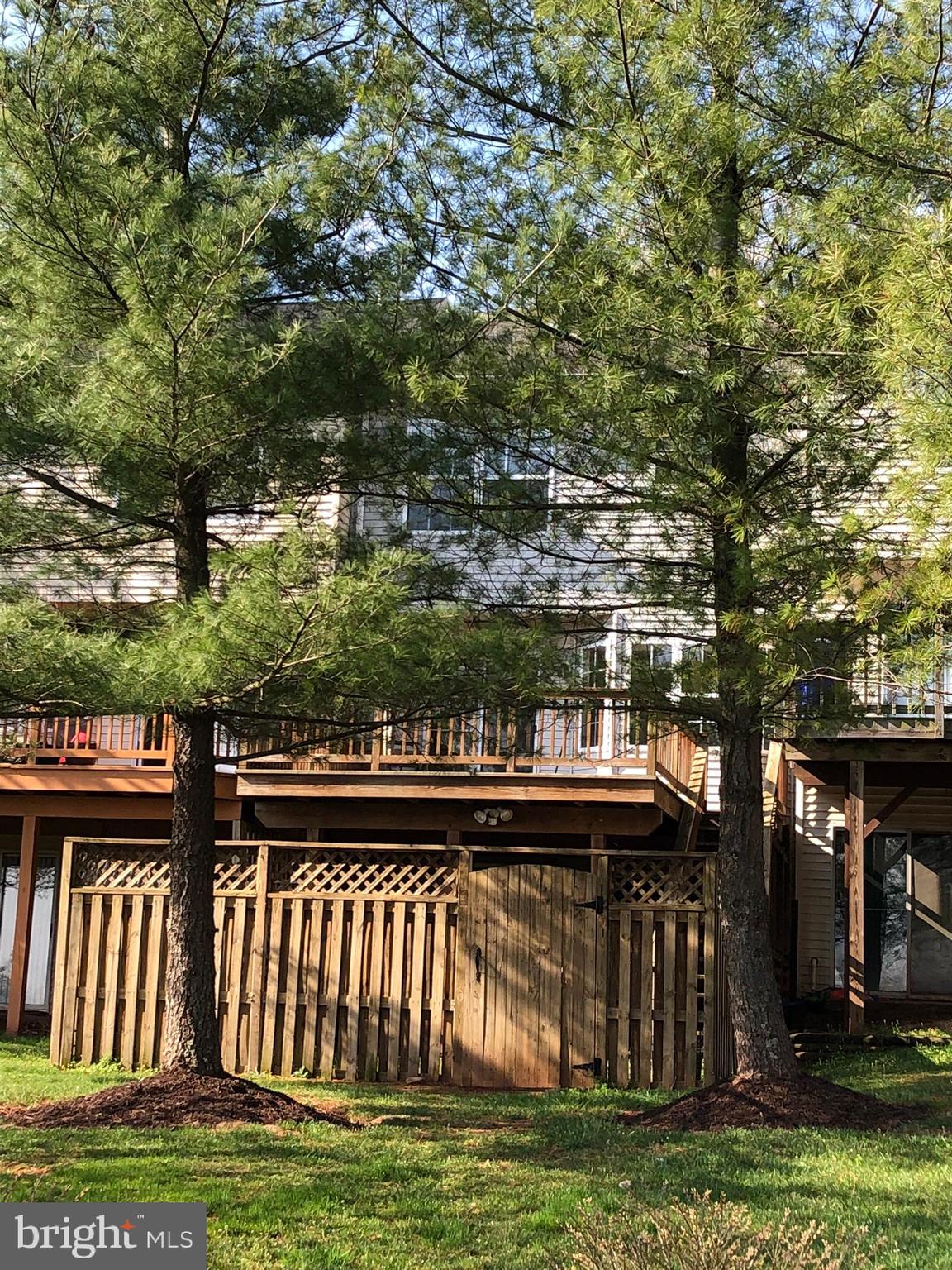 6412 View Point Court Frederick, MD 21703 - Photo 35 of 38 a view of a roof deck with wooden floor and fence