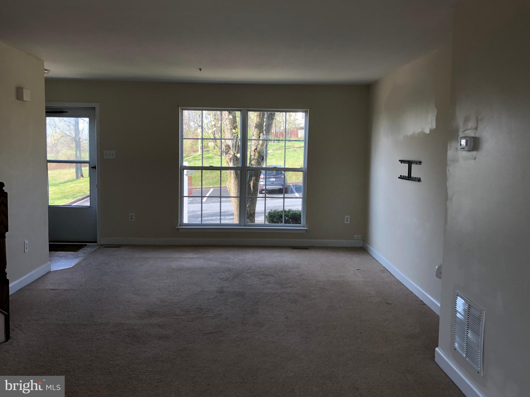 6412 View Point Court Frederick, MD 21703 - Photo 38 of 38 a view of an empty room with window and stairs
