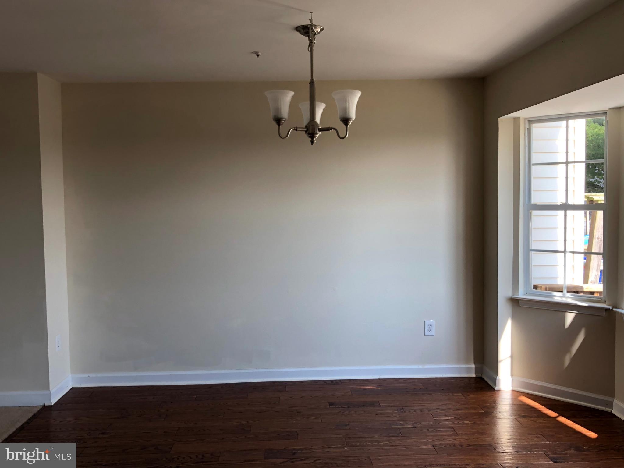6412 View Point Court Frederick, MD 21703 - Photo 6 of 38 a view of a room with wooden floor and a window