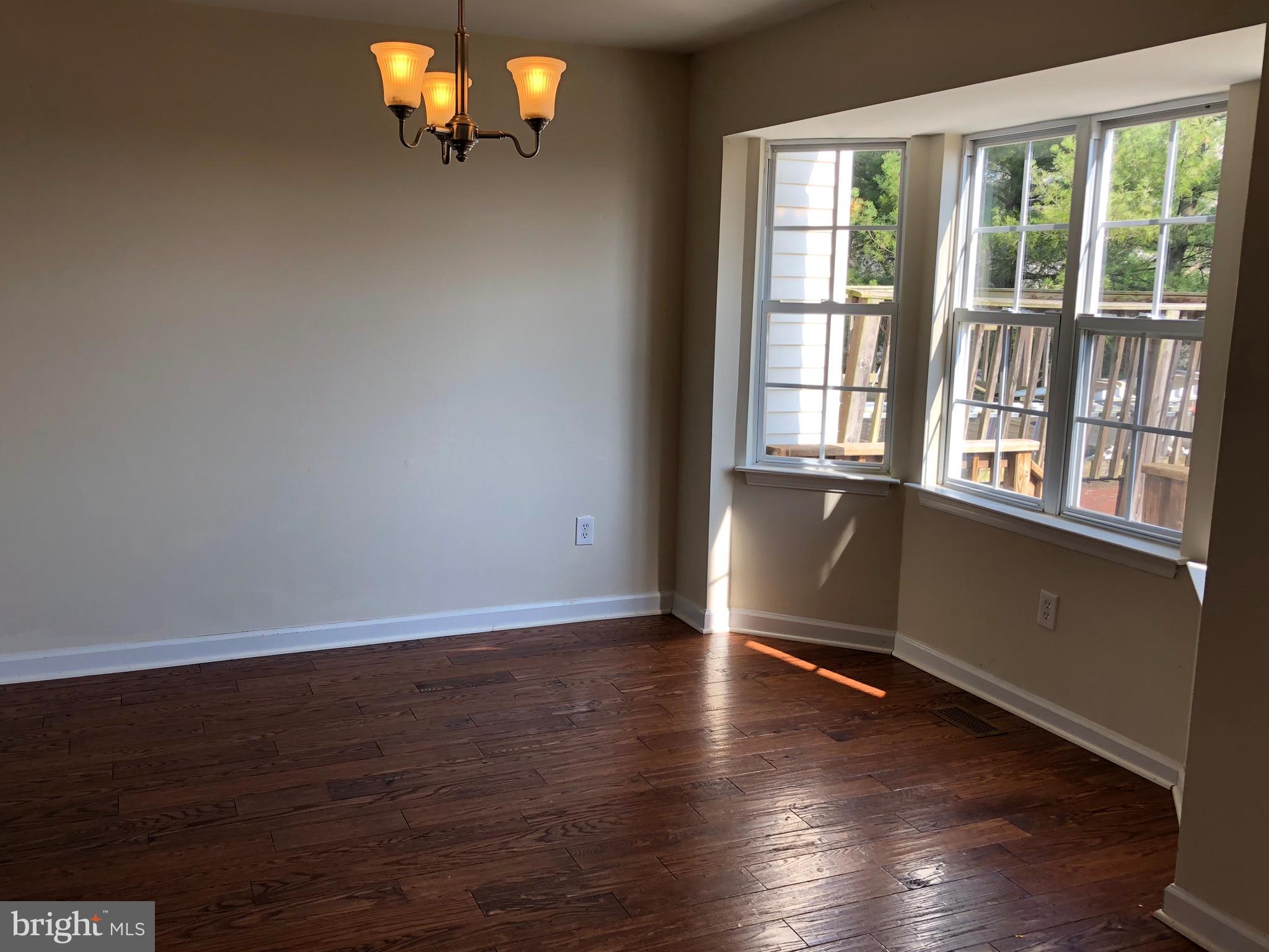 6412 View Point Court Frederick, MD 21703 - Photo 7 of 38 wooden floor in an empty room with a window