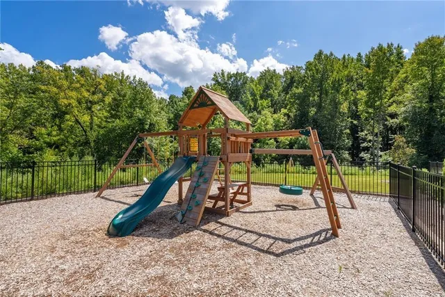 an outdoor sitting area with furniture