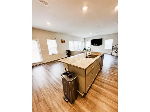 a living room with furniture and a rug