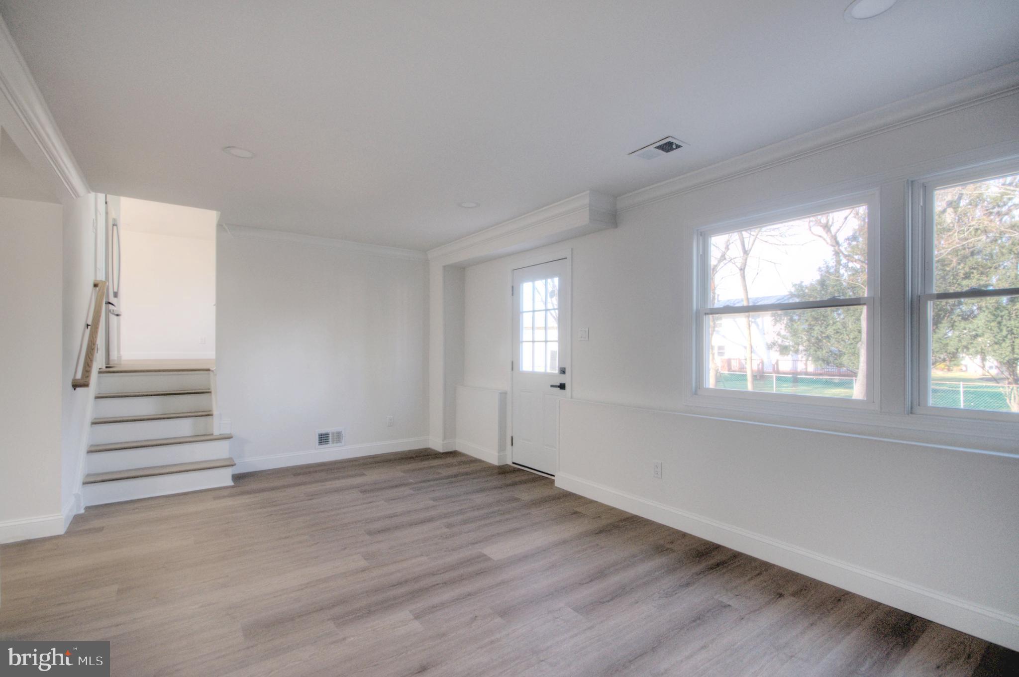 924 Cropwell Road Cherry Hill, NJ 08003 - Photo 35 of 76 an empty room with wooden floor and windows