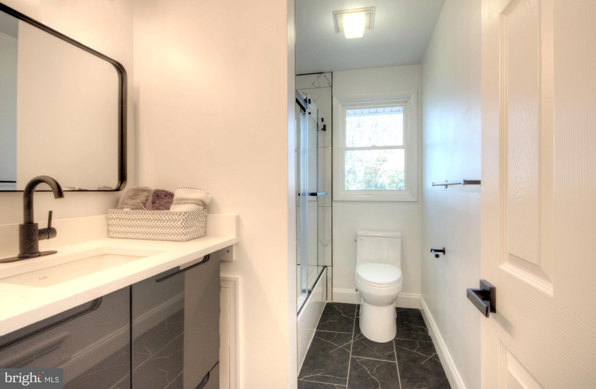 924 Cropwell Road Cherry Hill, NJ 08003 - Photo 49 of 76 a bathroom with a sink and a mirror