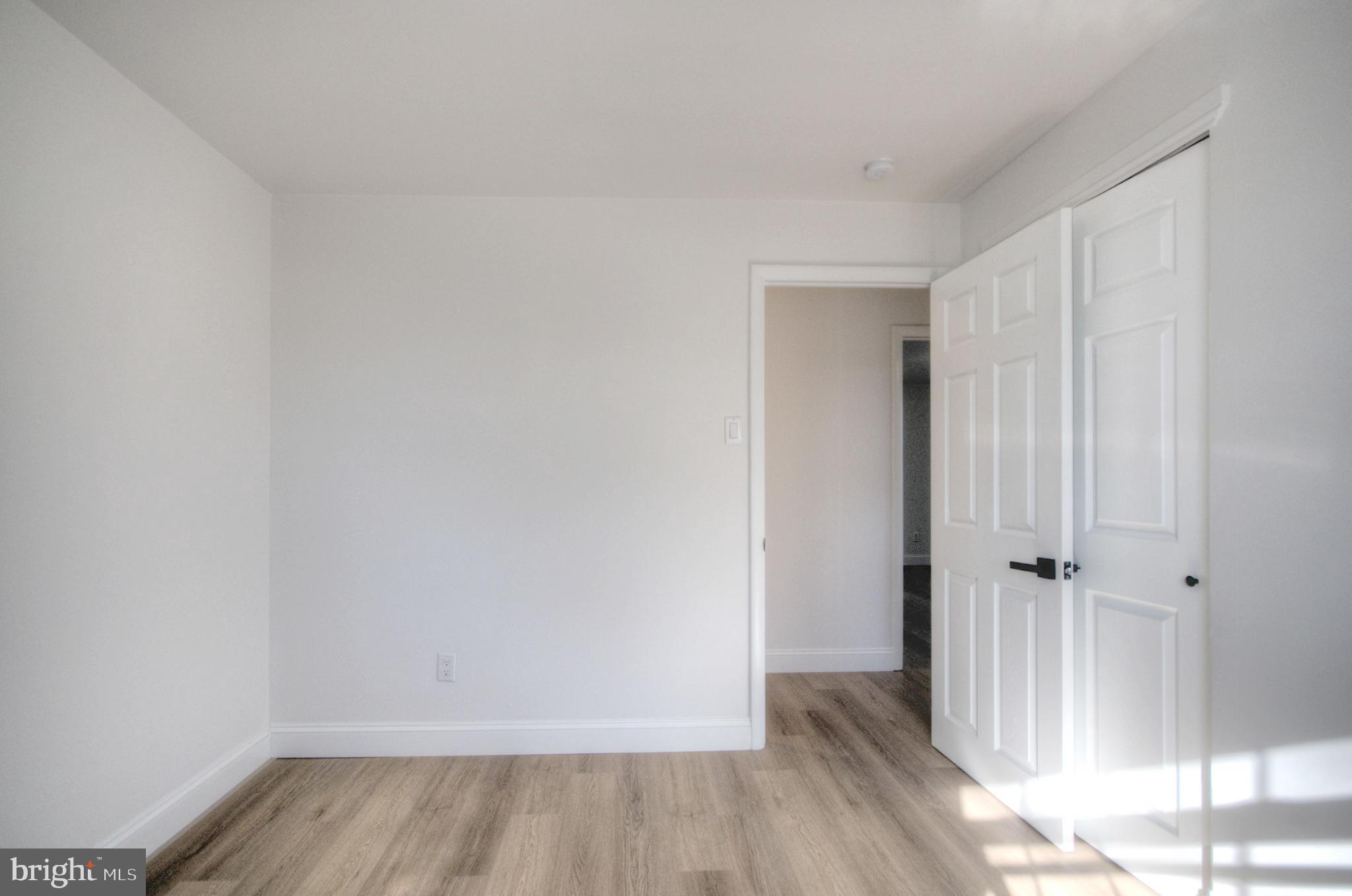 924 Cropwell Road Cherry Hill, NJ 08003 - Photo 54 of 76 an empty room with wooden floor and a window