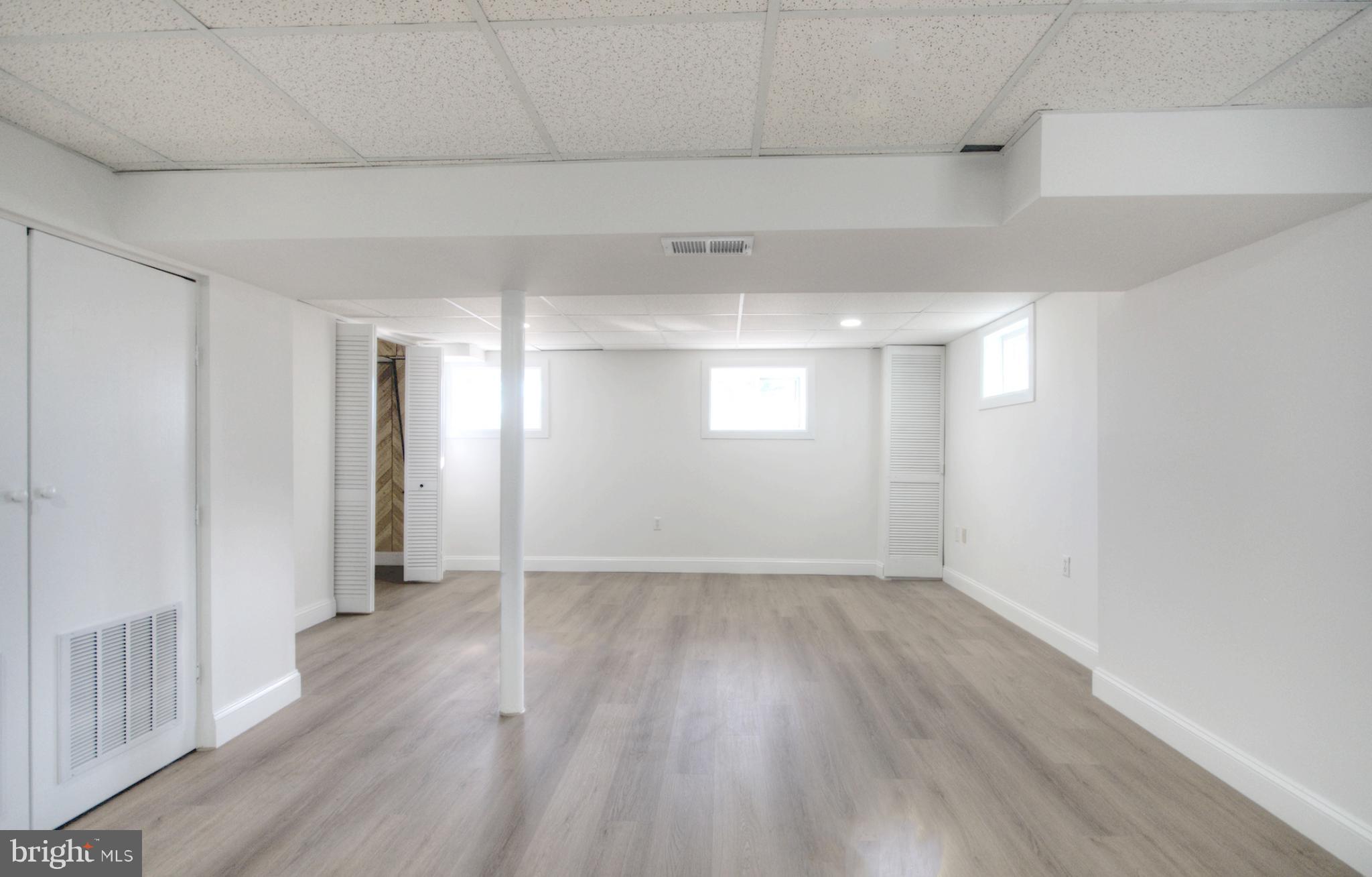 924 Cropwell Road Cherry Hill, NJ 08003 - Photo 73 of 76 a view of an empty room with wooden floor and a window
