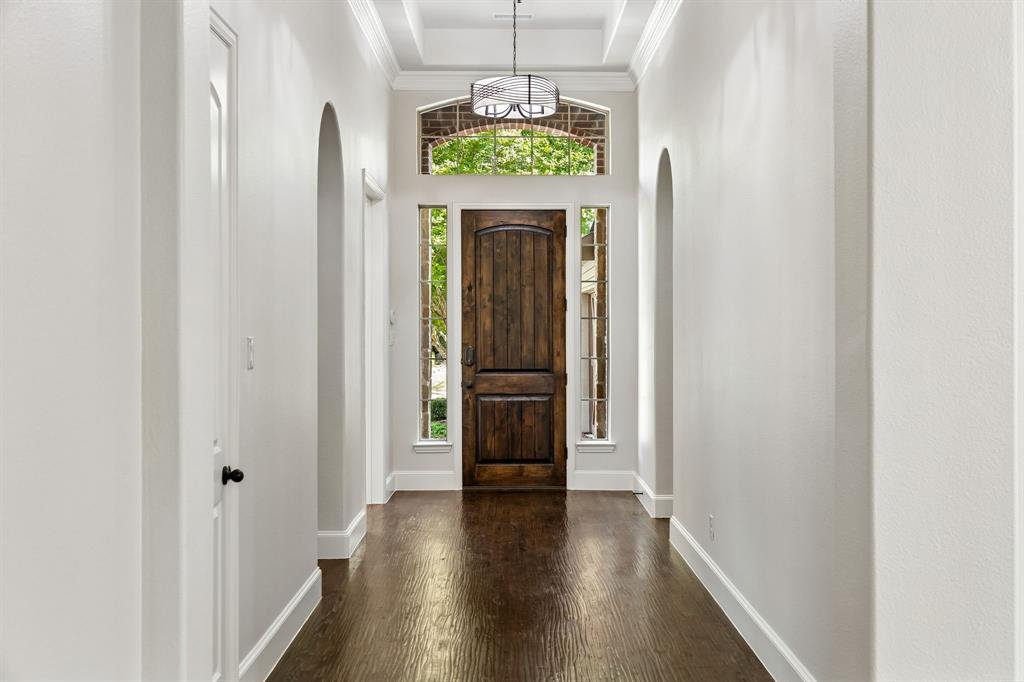 1567 Red Rock Canyon Road Frisco, TX 75036 - Photo 5 of 36 Wide hallway entrance with gleaming hardwood floors.