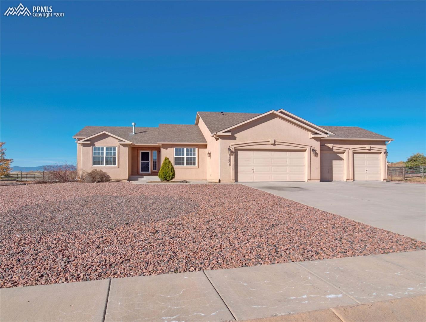 11601 Rio Secco Road Peyton, CO 80831 - Photo 1 of 36 Stunning Stucco Ranch Home on an Acre with Pikes Peak Views