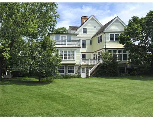 79 Bush Avenue Greenwich, CT 06830 - Photo 19 of 19 a front view of a house with a garden