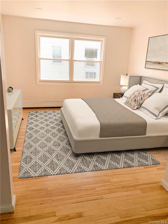 5 Ridge Road, Unit 2 Dobbs Ferry, NY 10522 - Photo 8 of 18 a bedroom with a bed and a window