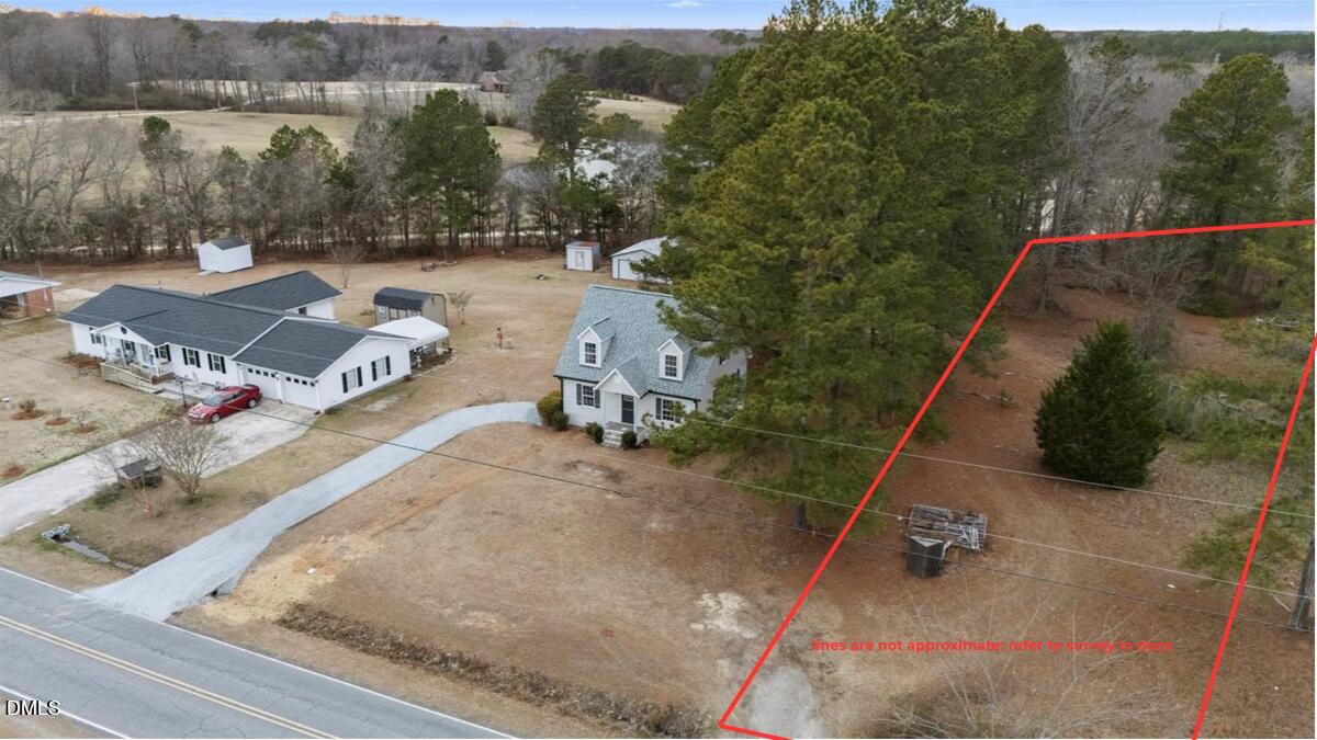 1126 Aquilla Road Benson, NC 27504 - Photo 2 of 3 an aerial view of a house with a yard basket ball court and outdoor seating