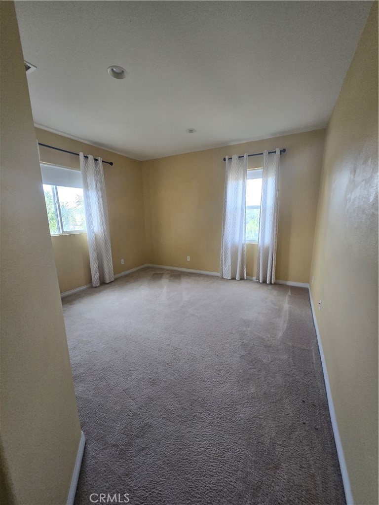 16231 Yarmouth Circle Riverside, CA 92503 - Photo 15 of 27 an empty room with windows and entrance