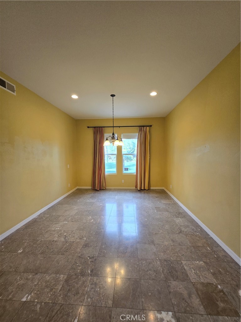 16231 Yarmouth Circle Riverside, CA 92503 - Photo 20 of 27 a view of an empty room with a window