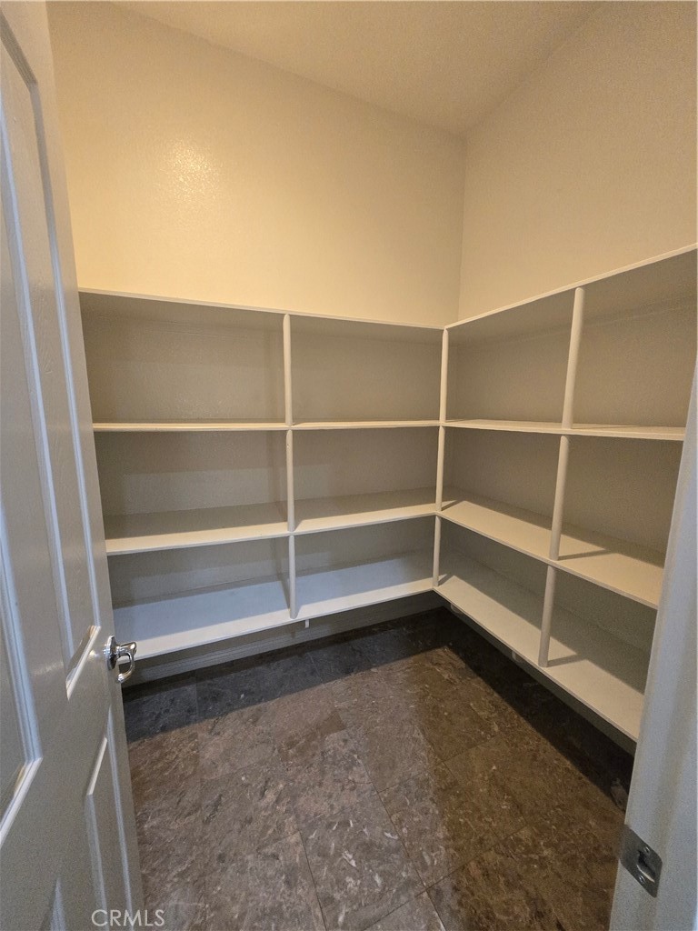 16231 Yarmouth Circle Riverside, CA 92503 - Photo 21 of 27 a view of walk in closet with empty racks