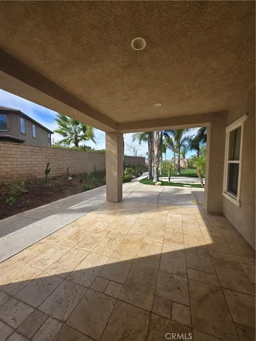 a view of a street with palm trees