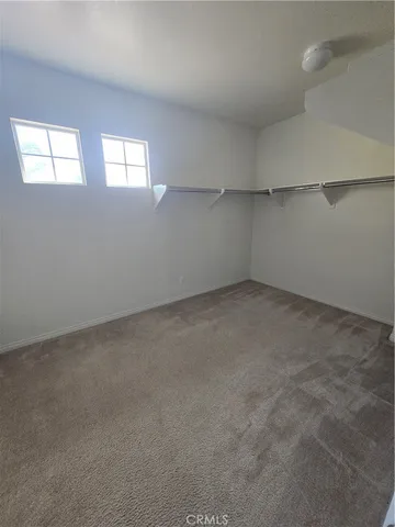 a large kitchen with stainless steel appliances granite countertop a sink stove and cabinets