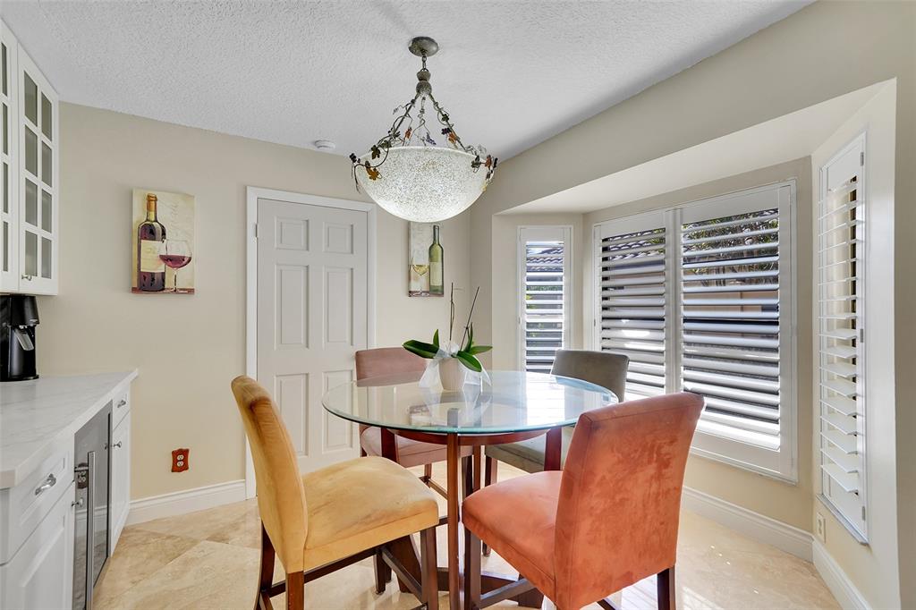 1581 Northwest 100th Way Plantation, FL 33322 - Photo 23 of 53 a view of a dining room with furniture window and wooden floor