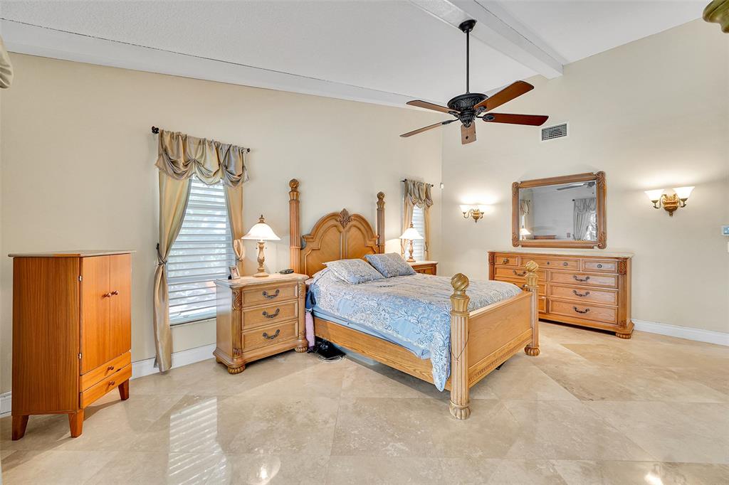 1581 Northwest 100th Way Plantation, FL 33322 - Photo 26 of 53 a bedroom with a bed and ceiling fan