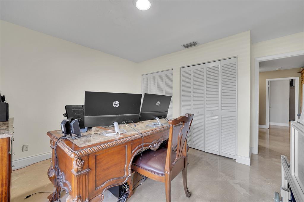 1581 Northwest 100th Way Plantation, FL 33322 - Photo 32 of 53 a workspace with furniture and lamp