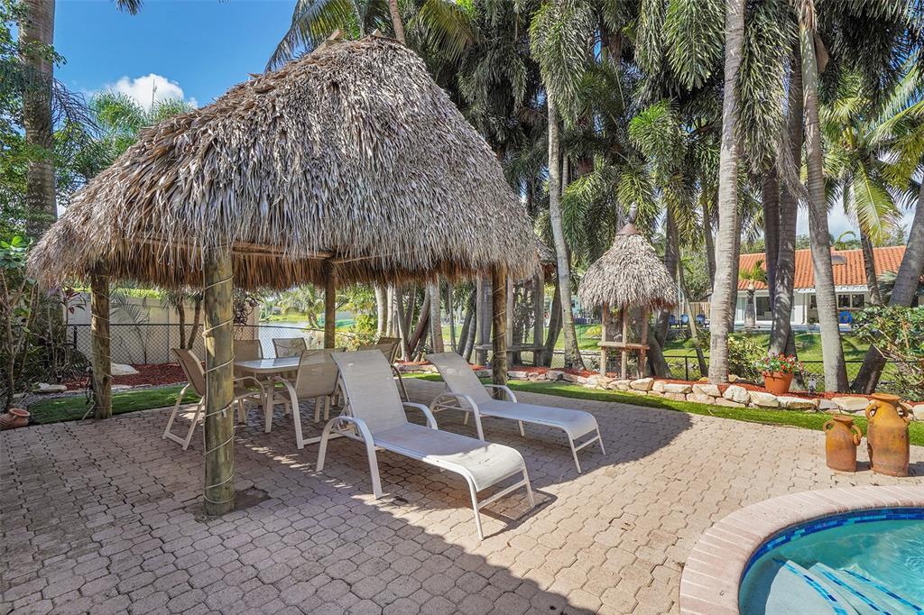 1581 Northwest 100th Way Plantation, FL 33322 - Photo 39 of 53 a view of outdoor space yard deck patio and outdoor kitchen