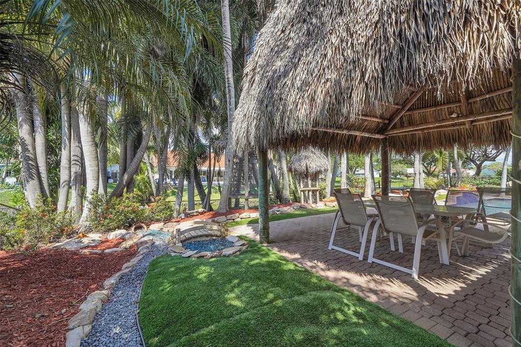 1581 Northwest 100th Way Plantation, FL 33322 - Photo 40 of 53 a view of a backyard with sitting area