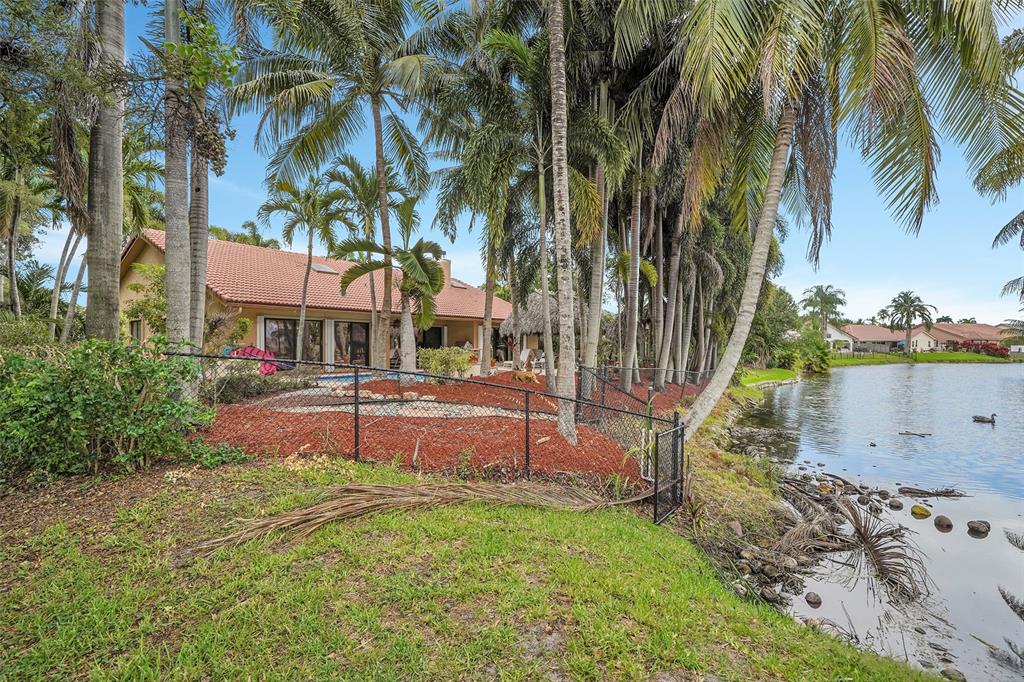 1581 Northwest 100th Way Plantation, FL 33322 - Photo 49 of 53 a front view of a house with garden