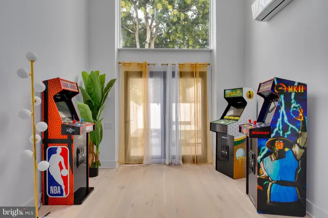 a view of play room with windows and couch