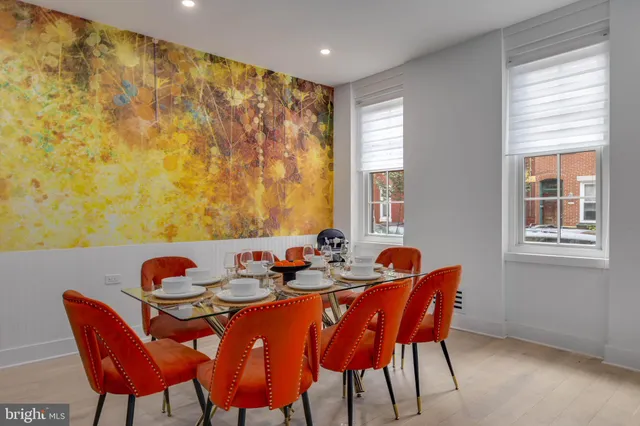 a dining room with furniture and window